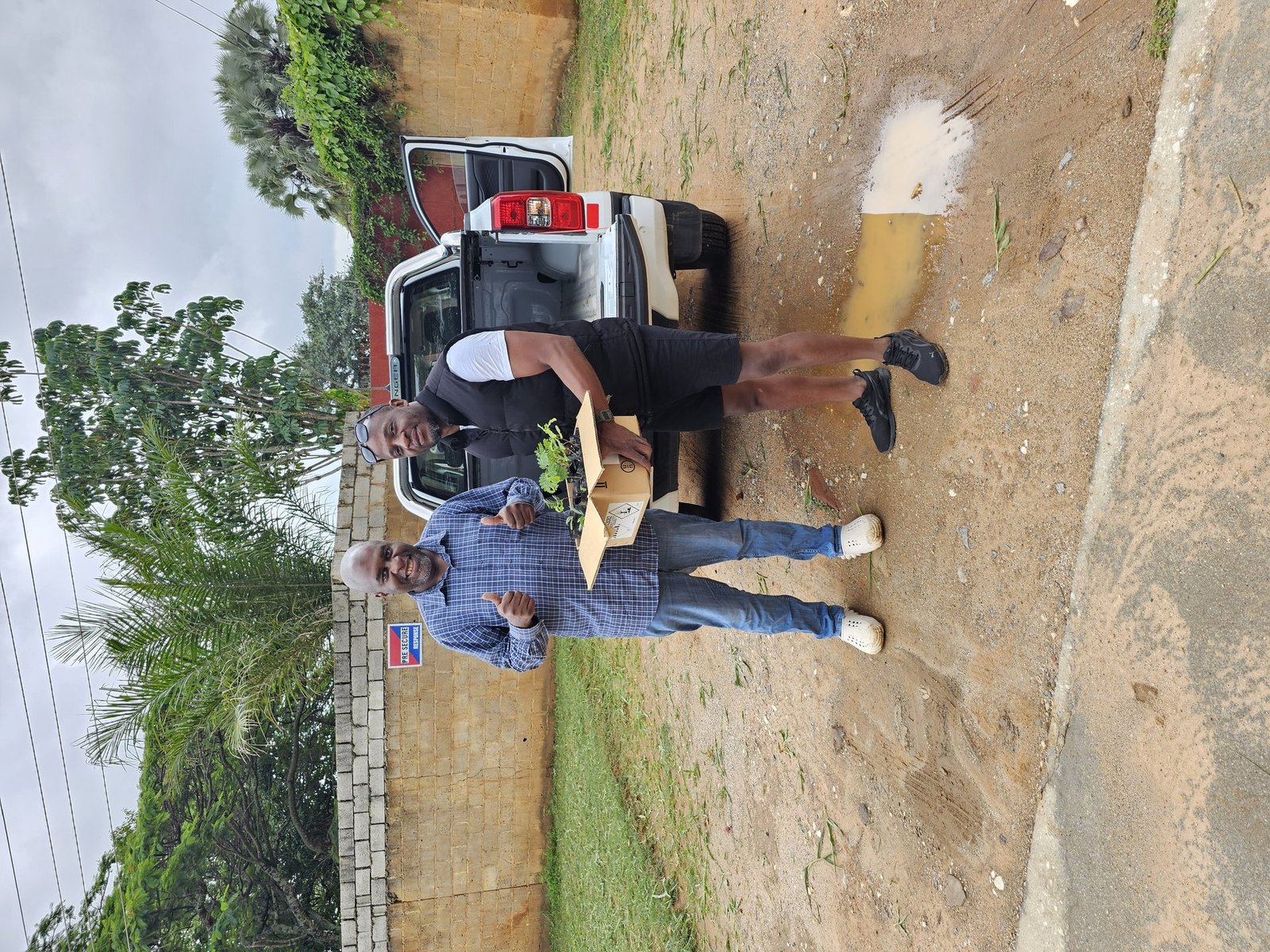 Seedling handover — happy recipient